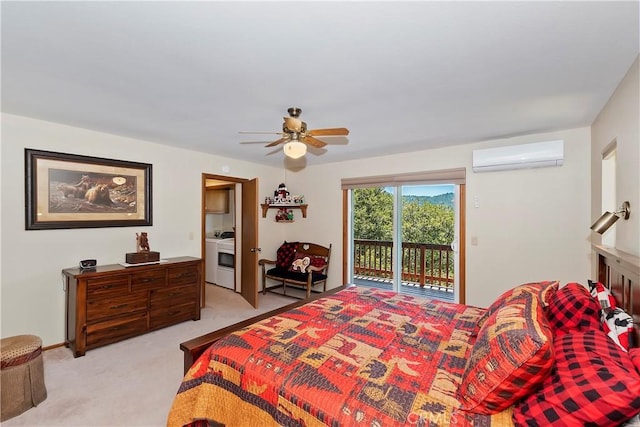 carpeted bedroom featuring washer / dryer, a wall mounted AC, ceiling fan, and access to exterior