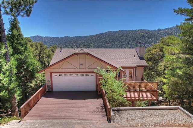 view of front of house with a deck with mountain view