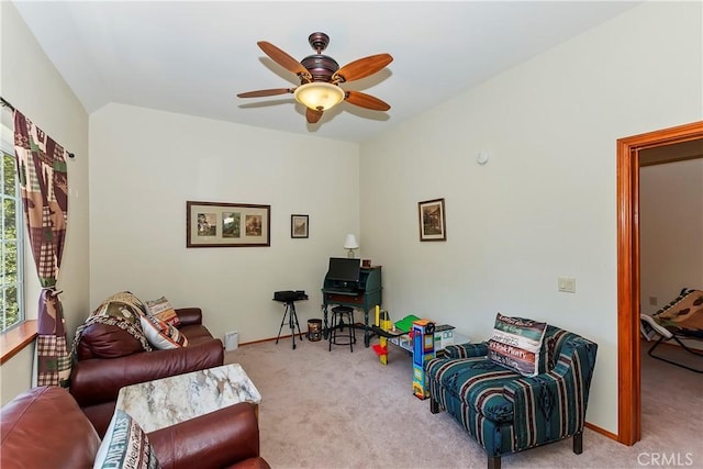 living room featuring ceiling fan and light colored carpet