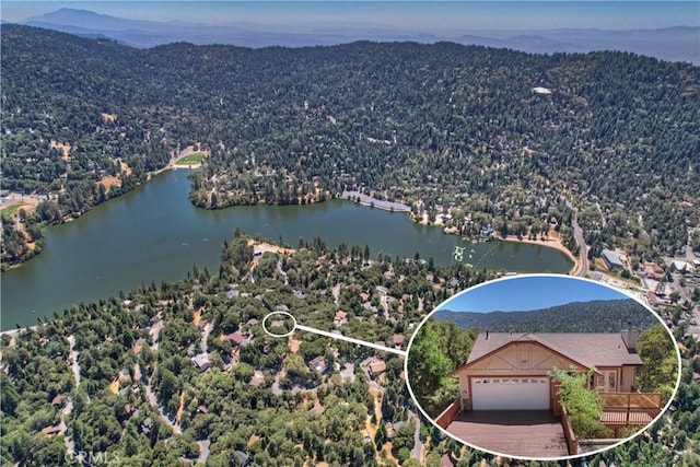 aerial view featuring a water and mountain view