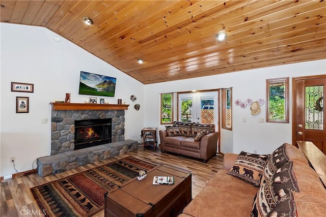 living room with light hardwood / wood-style floors, plenty of natural light, and wooden ceiling