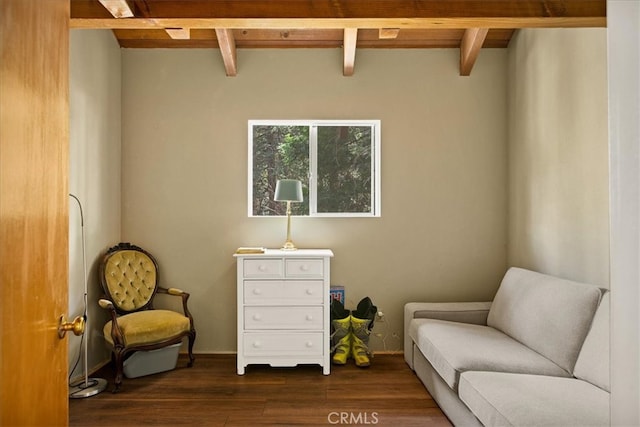 sitting room with beamed ceiling and dark hardwood / wood-style flooring