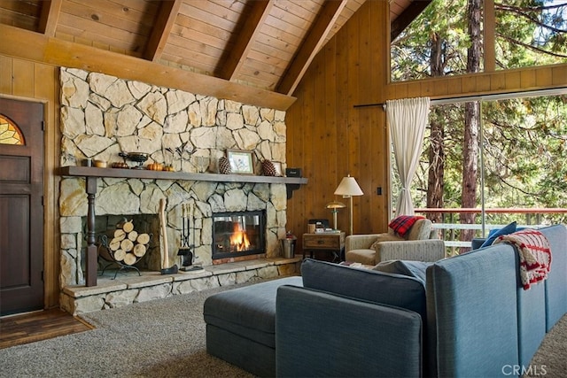 carpeted living room with beam ceiling, wooden walls, wooden ceiling, a fireplace, and high vaulted ceiling