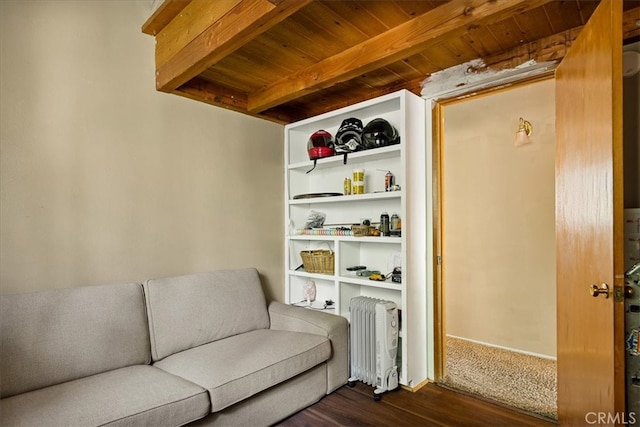 living area with wood ceiling, dark wood-type flooring, beam ceiling, and radiator