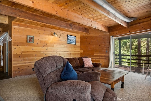 living room with beam ceiling, wood ceiling, carpet floors, and wood walls