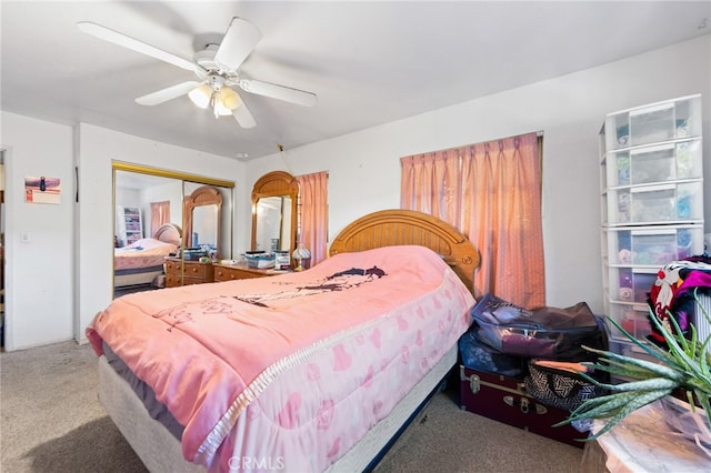 bedroom featuring carpet floors, ceiling fan, and a closet