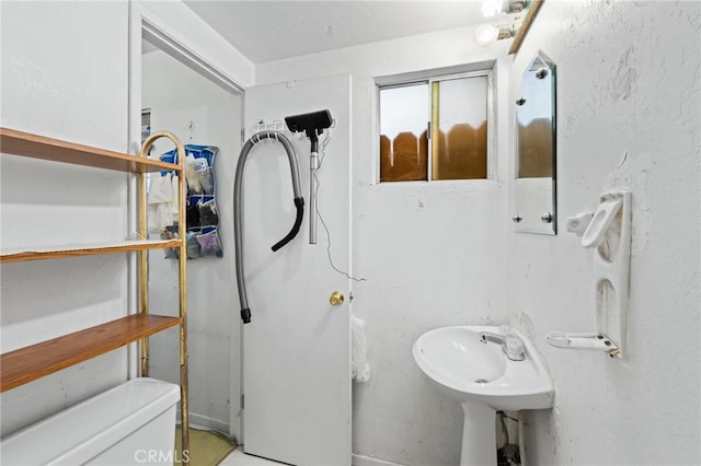 bathroom featuring toilet