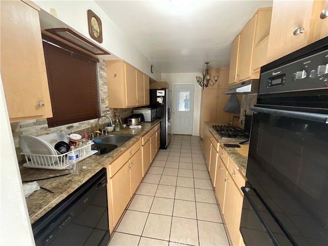 kitchen featuring black appliances, light tile patterned floors, light brown cabinetry, and sink