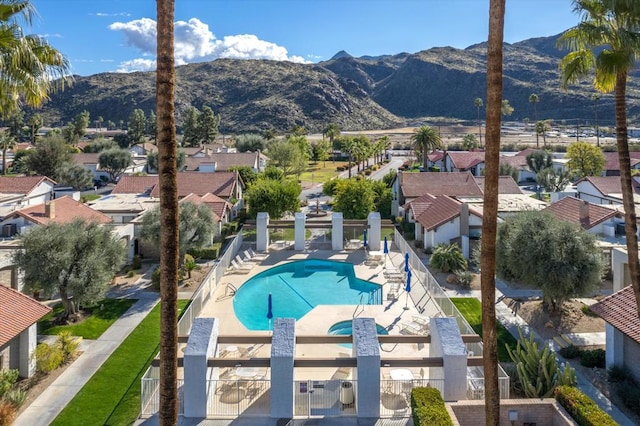 view of pool featuring a patio and a mountain view