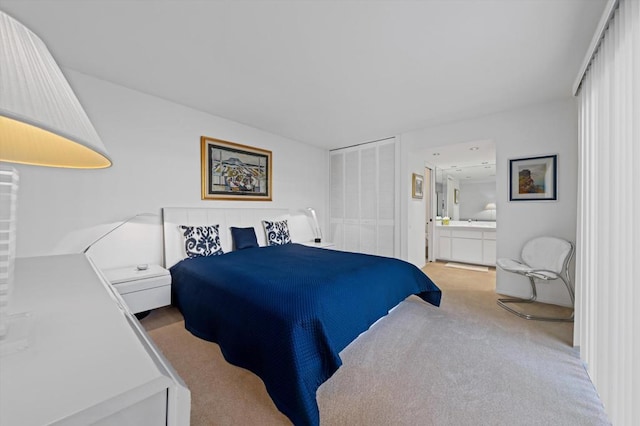 carpeted bedroom featuring connected bathroom and a closet