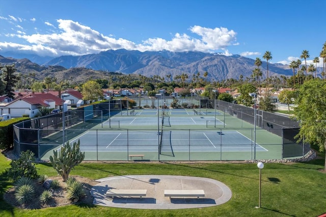 view of sport court with a lawn and a mountain view