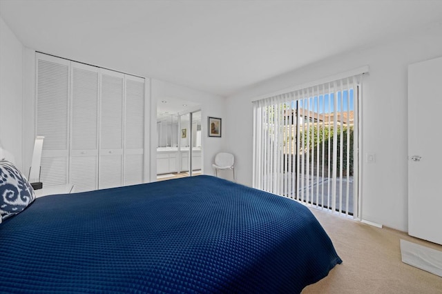 bedroom with light carpet, a closet, and access to exterior