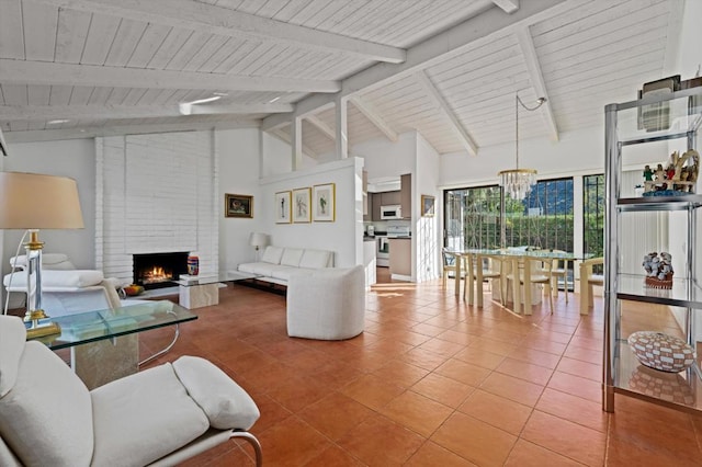 living room featuring tile patterned flooring, beam ceiling, high vaulted ceiling, and a fireplace