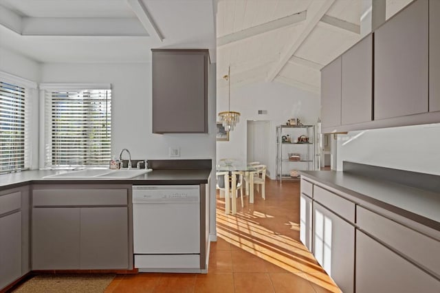 kitchen featuring light tile patterned flooring, lofted ceiling with beams, dishwasher, gray cabinets, and sink