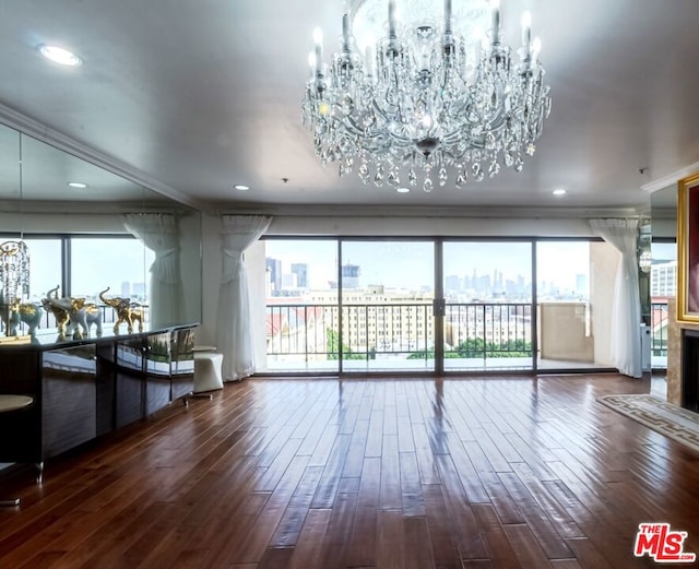 living room featuring ornamental molding, plenty of natural light, and dark hardwood / wood-style flooring