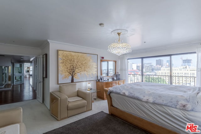 carpeted bedroom with access to outside, ornamental molding, and an inviting chandelier