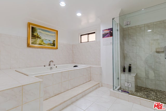 bathroom with independent shower and bath, ornamental molding, and tile patterned floors