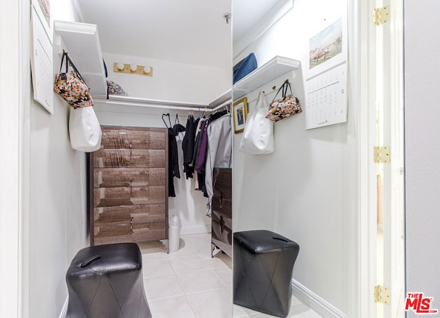 walk in closet featuring light tile patterned floors