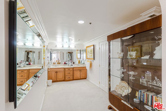 bathroom with crown molding and vanity