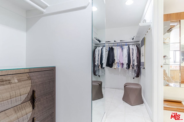 walk in closet featuring light tile patterned floors