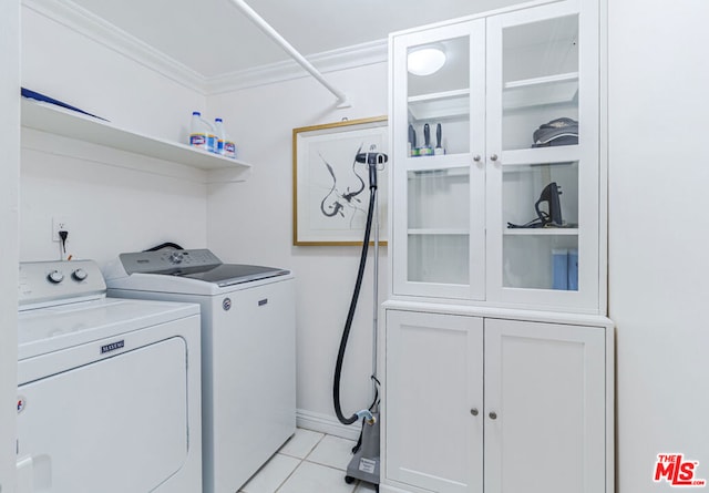 laundry room featuring light tile patterned floors and independent washer and dryer