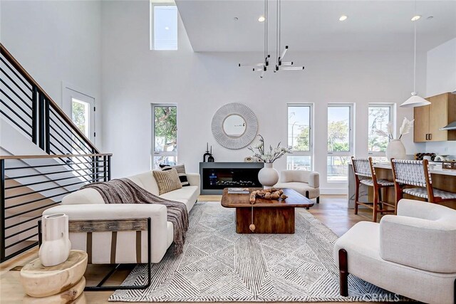 2304 Grant Ave Unit A, Redondo Beach, CA 90278 - living area featuring a high ceiling, stairs, recessed lighting, and light wood-style flooring