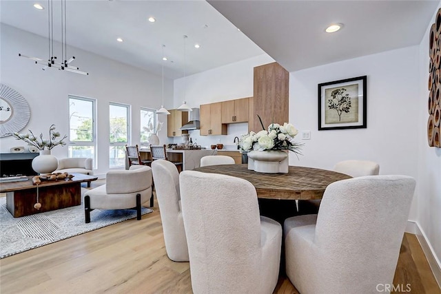 2304 Grant Ave Unit A, Redondo Beach, CA 90278 - dining area with light wood-style floors, recessed lighting, a high ceiling, and baseboards