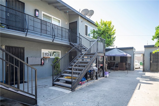 exterior space featuring a patio area and a bar