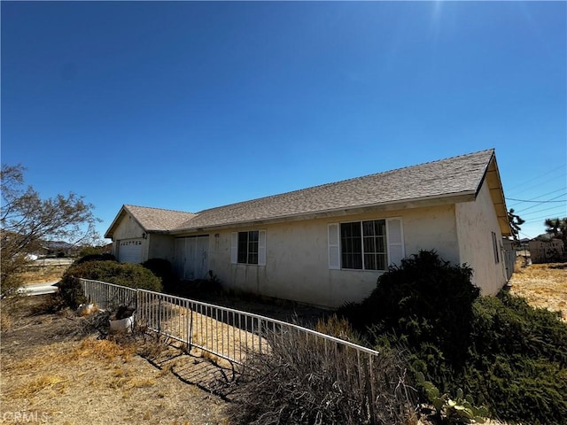 view of home's exterior with a garage