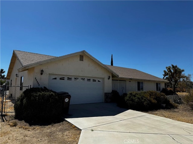 ranch-style house featuring a garage