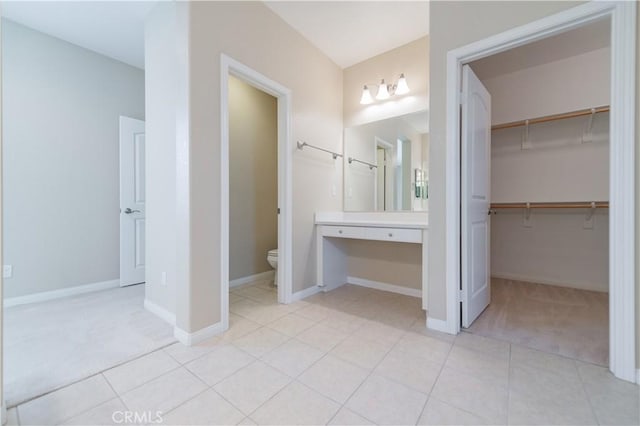 bathroom with tile patterned floors, toilet, and vanity