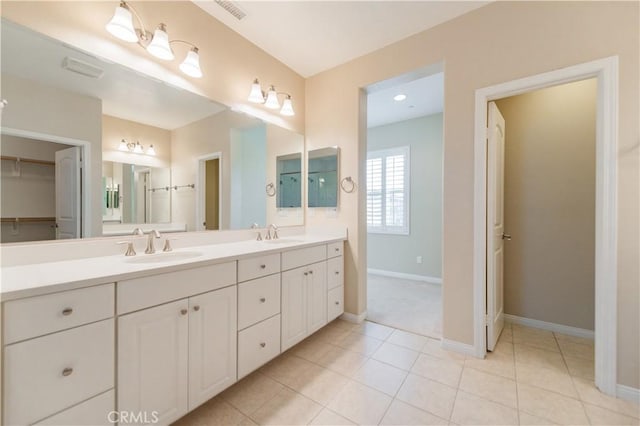 bathroom featuring tile patterned flooring and vanity