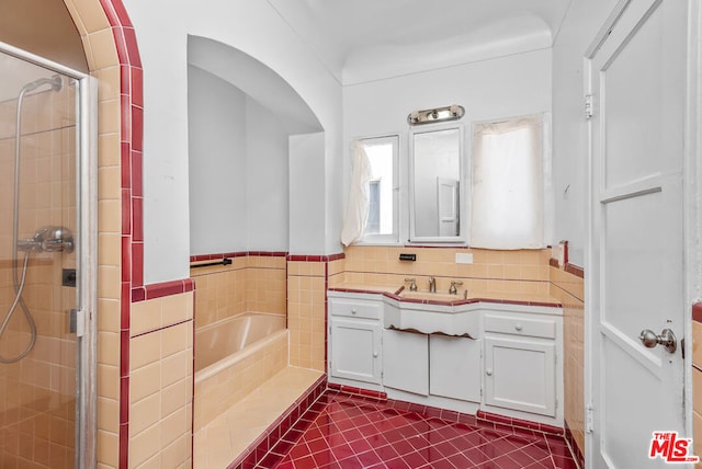 bathroom featuring vanity, separate shower and tub, and tile patterned floors