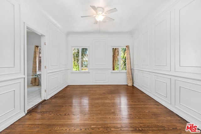 unfurnished room with ceiling fan and dark hardwood / wood-style floors