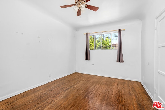 spare room featuring ceiling fan and hardwood / wood-style floors