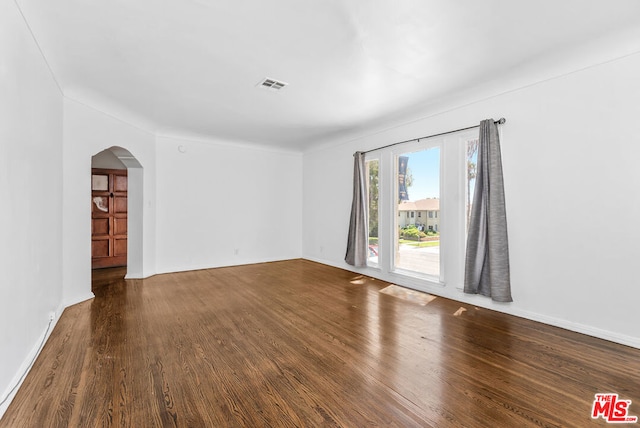 unfurnished room featuring wood-type flooring