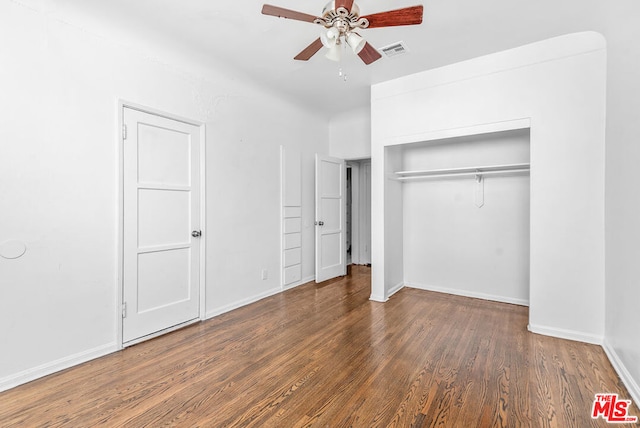 unfurnished bedroom with a closet, ceiling fan, and dark hardwood / wood-style floors