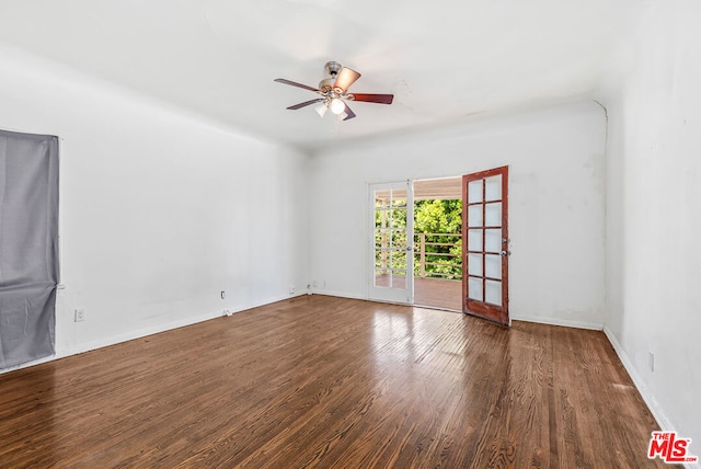 unfurnished room with ceiling fan and dark hardwood / wood-style flooring