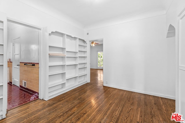 unfurnished room with ceiling fan and dark hardwood / wood-style floors