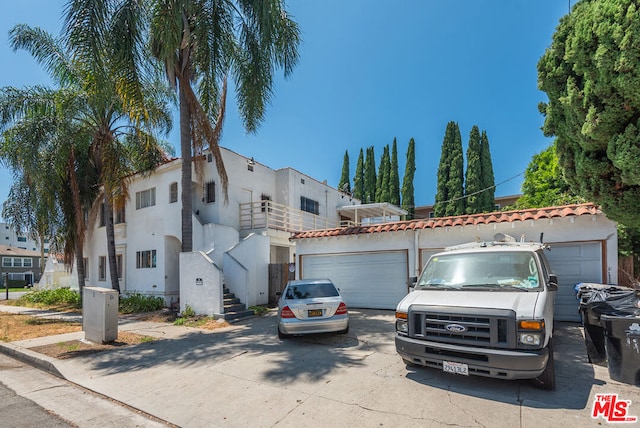 mediterranean / spanish house with a garage