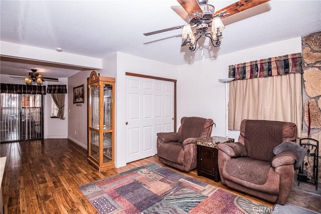 sitting room with dark hardwood / wood-style floors