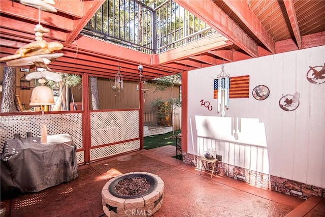 view of patio / terrace featuring area for grilling and a fire pit