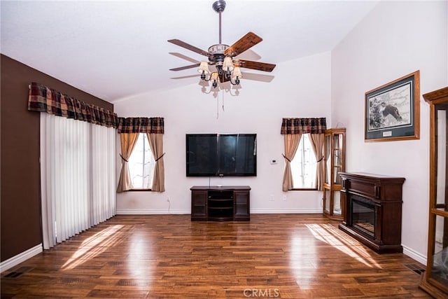 unfurnished living room featuring ceiling fan, dark hardwood / wood-style flooring, and lofted ceiling