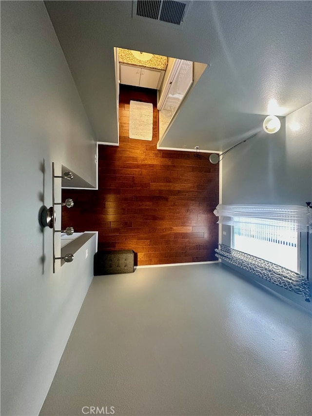 bonus room with wood walls