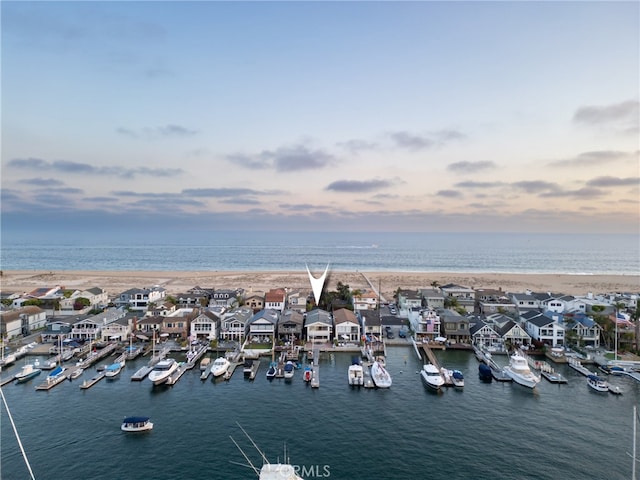 aerial view at dusk with a water view