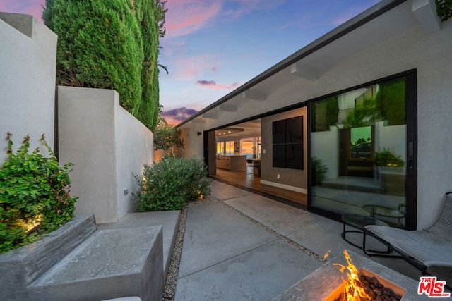 view of patio terrace at dusk