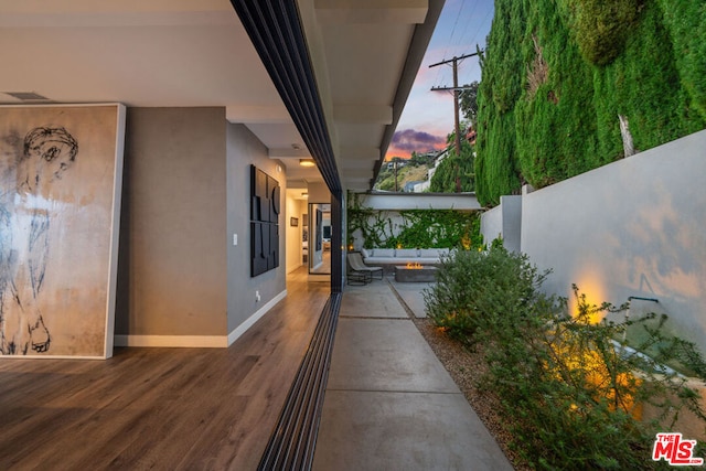 view of patio terrace at dusk