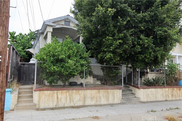 view of property hidden behind natural elements