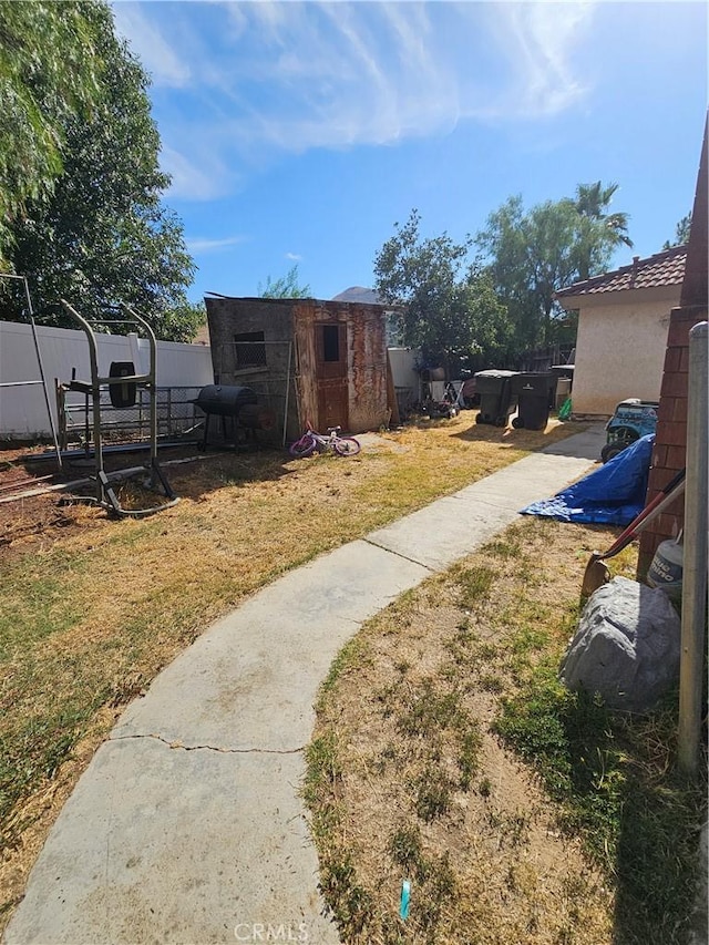 6757 Sunnyvale Dr, Riverside, CA 92505 - view of yard with a storage shed, fence, and an outdoor structure