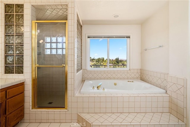 bathroom featuring vanity, tile patterned floors, and independent shower and bath